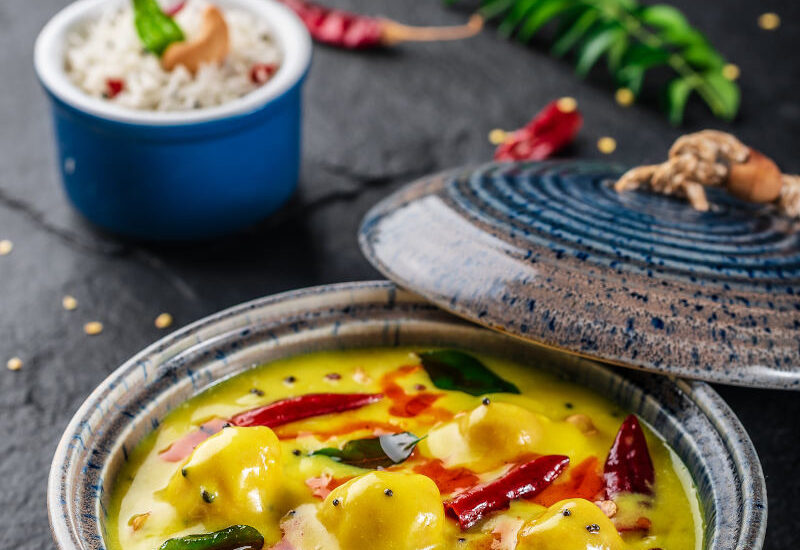 Gram flour and Yogurt based yellow curry with fritters, Pakoda kadhi or karhi, food photography